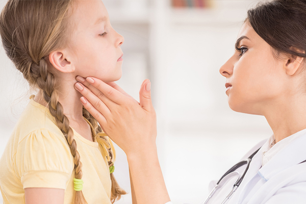 Cheerful baby high five to pediatrician doctor